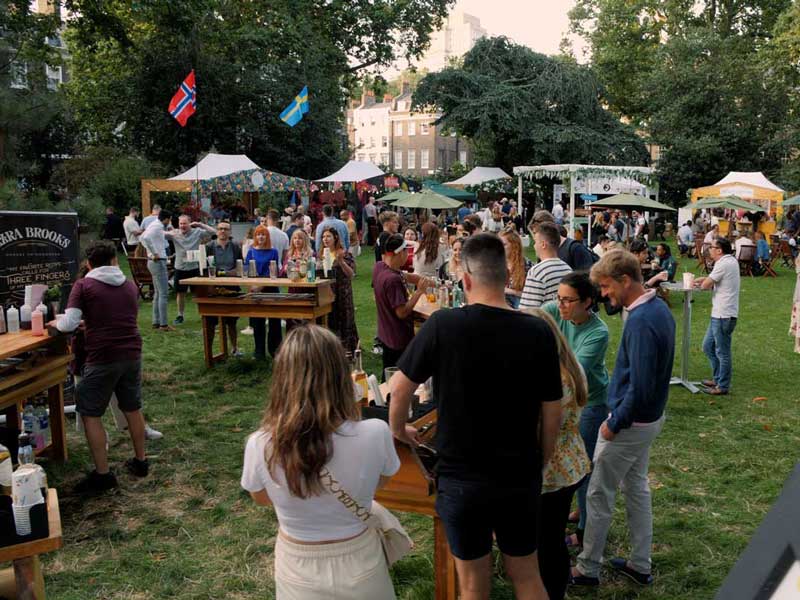 Lots of cocktail bars set up outside in a park in central London