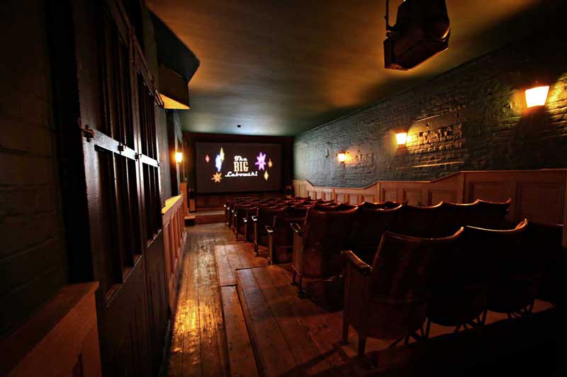 View of chairs inside the cinema at TT Liquor